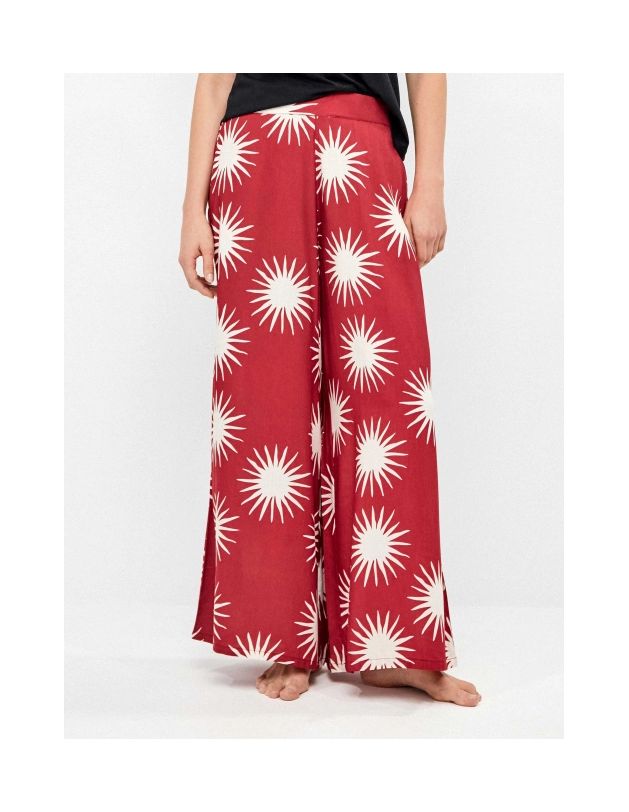 Pantalón largo pierna ancha estampado soles in...